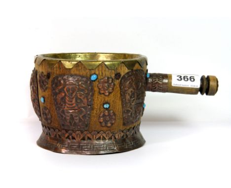 An interesting hammered copper decorated South American water ladle, H. 12cm.