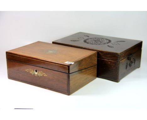 A mother of pearl and brass inlaid mahogany box and a carved wooden box.