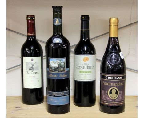 Four bottles of vintage red wine.
