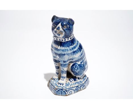 A Dutch Delft blue and white model of a cat, 1st half 19th C. H.: 18 cm We have more lots available for bidding on on our web