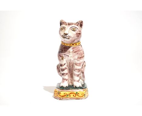 A polychrome Dutch Delft model of a cat, 19th C. H.: 17,5 cm - L.: 10,5 cm - W.: 8 cm We have more lots available for bidding