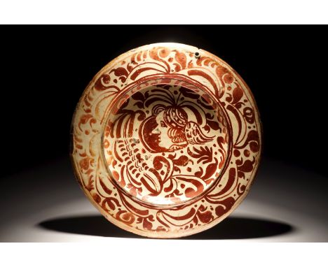 A Hispano-Moresque luster glazed portrait dish, Spain, 17th C. Dia.: 30,5 cm We have more lots available for bidding on on ou