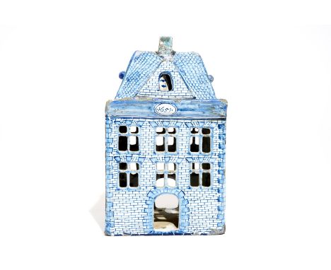A Dutch Delft blue and white model of a house, 18th C. H.: 24,5 cm - L.: 14,5 cm - W.: 14 cm  Provenance: A French private co