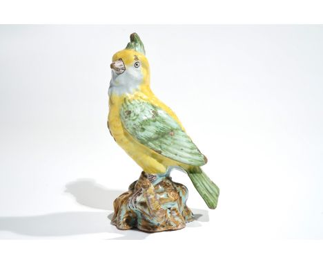 A polychrome Dutch Delft or French faience model of a bird, 18/19th C. H.: 17,5 cm We have more lots available for bidding on