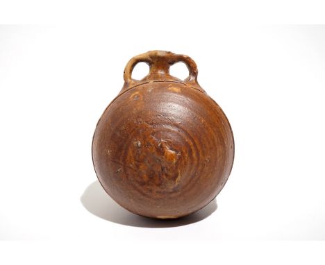 A salt glazed stoneware pilgrim's flask, Siegburg, Germany, 15th C. H.: 14,5 cm - L.: 12,5 cm - W.: 11 cm We have more lots a