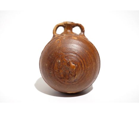 A salt glazed stoneware pilgrim's flask, Siegburg, Germany, 15th C. H.: 14,5 cm - L.: 12,5 cm - W.: 11 cm We have more lots a