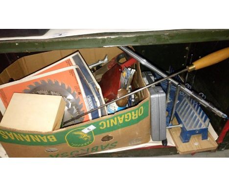 A quantity of various carpentry tools including mitre saw, circular saw blades & chisels etc.