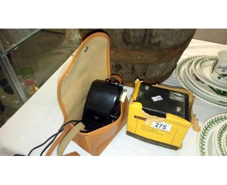 A Kodak bakelite127 camera in case and a Kodak Brownie Model 1 camera in box