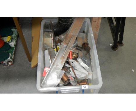 A large box of sundry items and a collapsable work bench