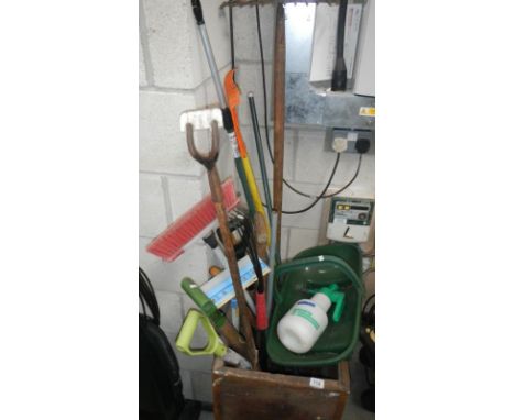 A tea chest of garden tools etc