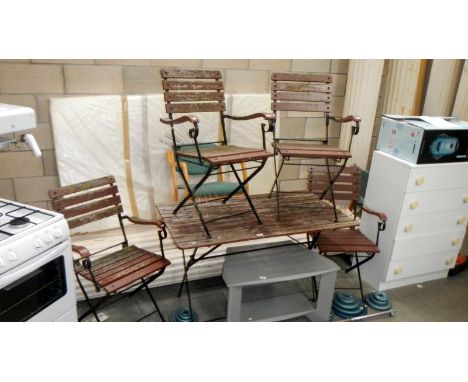 A garden bench and 4 chairs