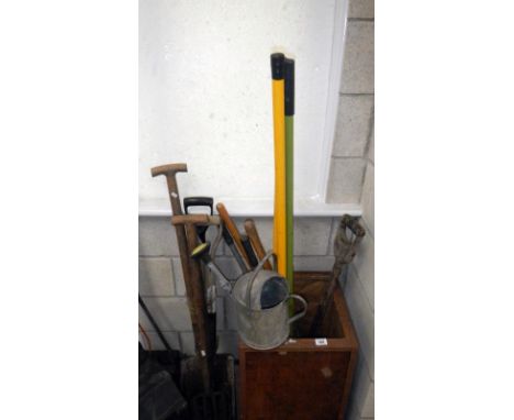 A tea chest of garden tools etc