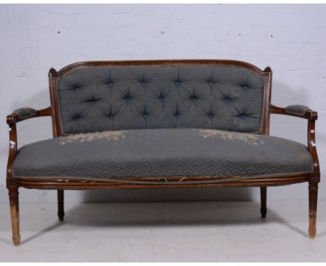 Louis XVI style stained beechwood sofa, blue quilted upholstery, fluted legs, width 150cm.