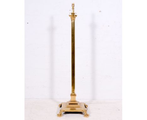 Brass Corinthian column standard lamp, fluted shaft, claw feet, 134cm.