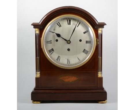 A mahogany cased fusee mantel clock, 18.5cm slightly concave silvered dial with a Roman numeral chapter ring, three train  mo