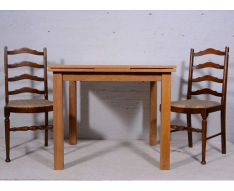 Light oak draw-leaf kitchen table, square supports, 90cm x 90cm closed and four oak ladder-back dining chairs, with drop-in s