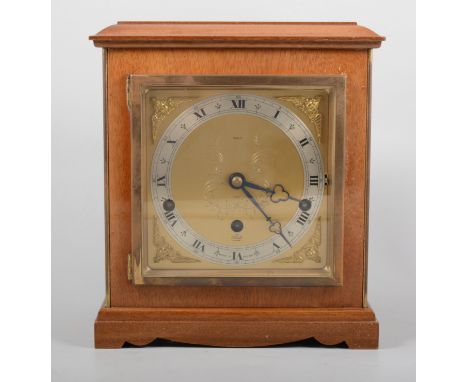 An Elliott walnut cased 8 day lever three train mantel clock, 14cm brass dial named Tarratt with a silvered Roman numeral cha