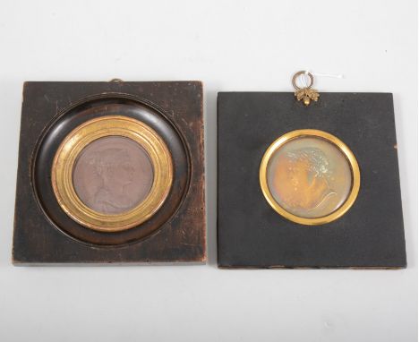 A portrait medal of "Josephine Imp.Et Reine" 6cm, in a 14cm square wooden frame a companion medal of " Napoleon Empereur Des 