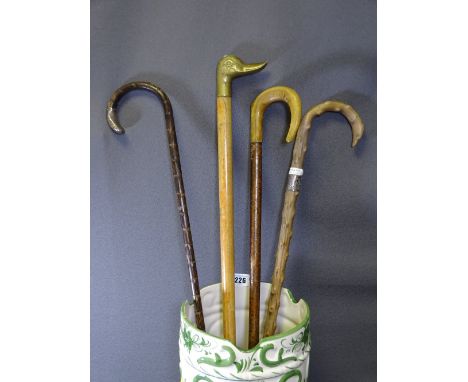 SILVER COLOURED &amp; OTHER WALKING STICKS and a porcelain stick stand