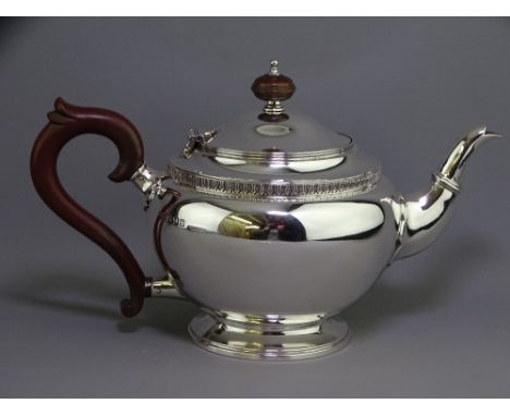 VINTAGE SILVER HEAVY TEAPOT - circular form on pedestal foot and with ornate girdle, London 1940, Goldsmiths &amp; Silversmit