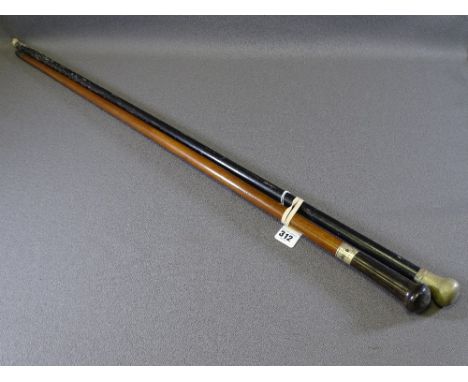 TWO WHITE METAL MOUNTED VINTAGE WALKING CANES including a mahogany example with ebony top and belt type collar, 85cms L and a