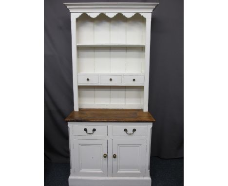 NEAT RUSTIC STYLE PAINTED KITCHEN DRESSER, two shelf rack with three central drawers over the base with stripped pine top, tw