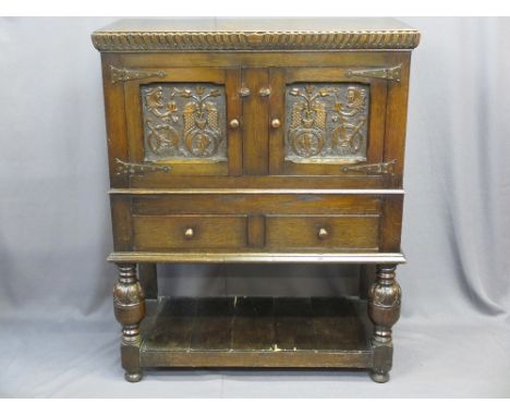 VINTAGE CONTINENTAL CARVED OAK BUFFET SIDEBOARD having twin upper doors with bird and mask detail over twin doors and pot boa