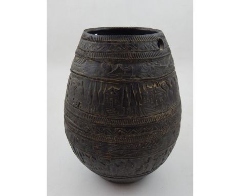 An unusual bronze vase of ovoid form, decorated all around with figures and rustic scenes.