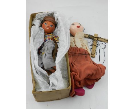 An unusual Pelham puppet SS type 'Cockney Boy/Girl', boxed, together with one other Pelham puppet. (2)