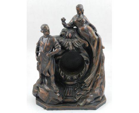 A coated bronze clock holder, modelled with classical figures, raised on a octagonal base, H.28cm