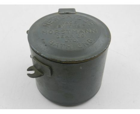 A Horstmann Gear Co. clockwork timer, of cylindrical form within a tin plate case with hinged cover. D. 8.5cm.