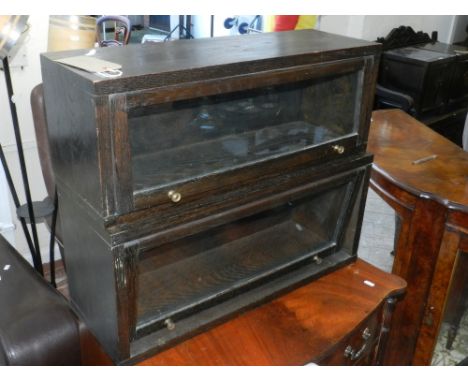 Two globe wernike style glazed oak bookcase sections