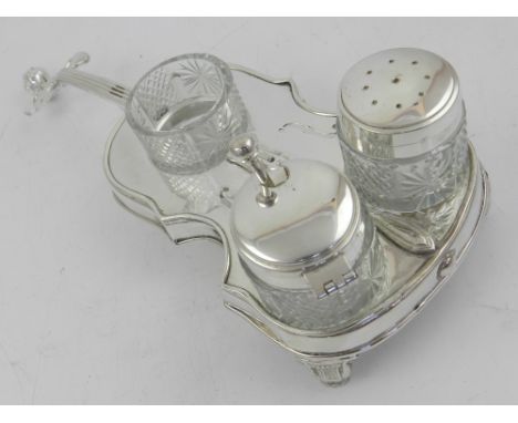 An unusual silver plated table condiment set in the form of a cello,