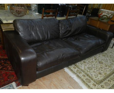 A large contemporary brown leather sofa, with two seat cushions, W. 234cm