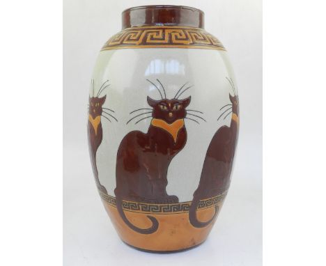 A Longwy style porcelain vase, having red and orange Greek key pattern decoration and rows of cats, on a cream ground. H: 30c