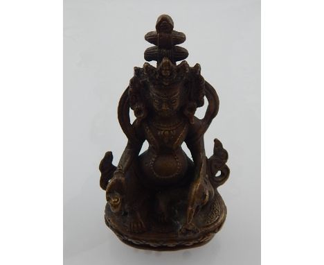 A Chinese bronze 'money' Buddha. H: 8.5cm