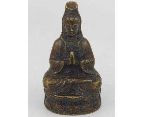 A small Tibetan bronze study of a deity. H: 7cm