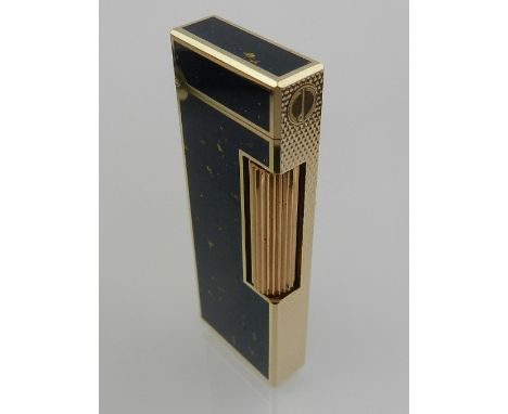 A gilt metal and lapis style Dunhill lighter. 