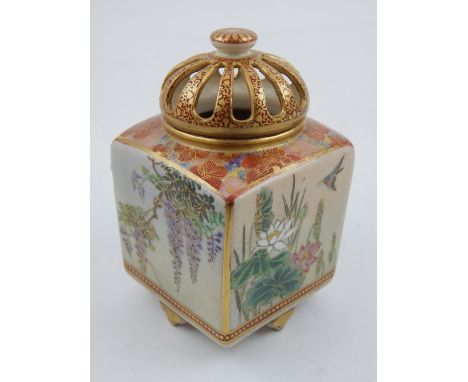 A Japanese satsuma incense burner of cubic form decorated with chrysanthemums, buddleia, and birds, the domed pierced pull of