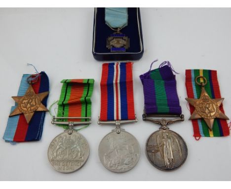 A WWII Defence medal 1939-1945, George VI medal 1939-1945, George VI medal Palestine, and two George VI Pacific Stars with ri