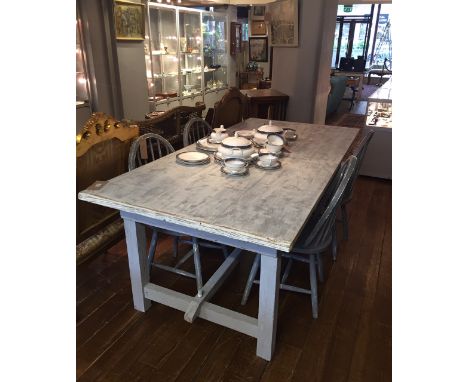 A rectangular refectory dining table, the moulded top on square underframe with centre stretcher, together with four comb bac