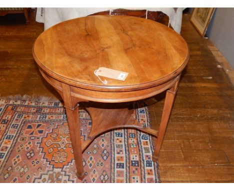 An Edwardian circular occasional table, the top with a moulded lip on square tapering legs joined by an undertier, D. 75cm