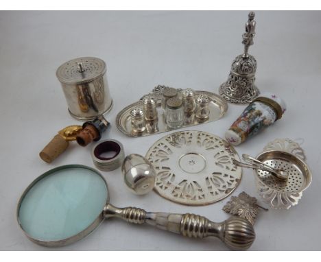 A quantity of silver and white metal items to include a silver tea strainer and dish, a set of white metal miniature condimen