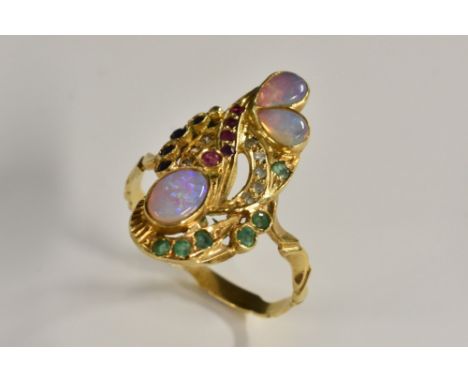 A moonstone, emerald, ruby, diamond and spinel naturalistic ally formed dress ring, yellow metal shank, stamped 750, size U, 