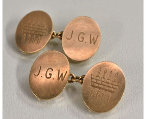 A pair of 9ct gold oval cufflinks, engraved with four arrow passing through turret top crenellations, initialled J.G.W, Chest