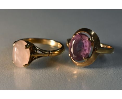 Rings - a pale pinky purple amethyst oval solitaire ring, 9ct gold shank, size K;  another oval rose quartz cabochon ring, 9c