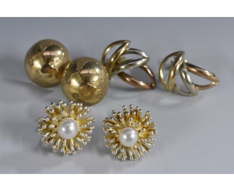 Earrings -  a pair of 9ct gold domed button earrings, stamped 375 BB, London import marks; a pair of 9ct gold stylized leafy 