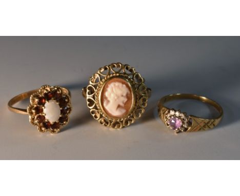 Rings - a 9ct gold opal and garnet oval cluster ring, size Q; a 9ct gold and amethyst and cz cluster ring; size Q a 9ct gold 