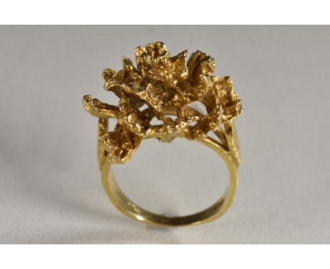 A 9ct gold modernist design multi layer textured ring, as a floral cluster, maker's mark HB, size R, London 1969, 9.7g