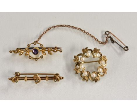 Brooches - an Edwardian amethyst and seed pearl floral wheel bar brooch, stamped 15ct, 3.2g gross;  a 9ct gold seed pearl bar